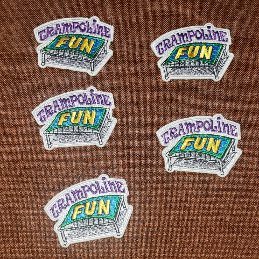 A lot of 5 Girl Scout patches - trampoline fun